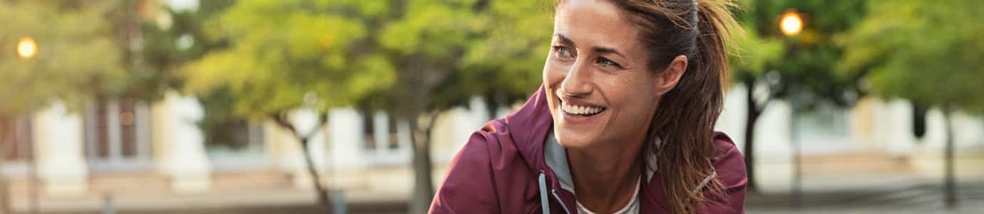Woman smiling outdoors