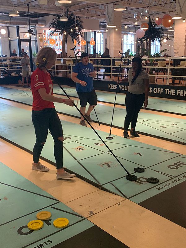 ibji team playing shuffle board