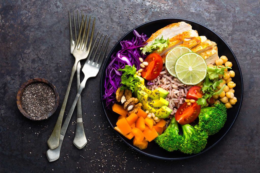 Healthy salad on table with silverware