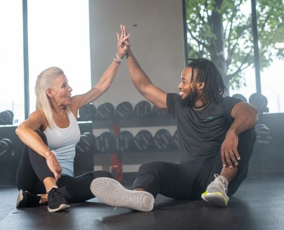HPI trainer and athlete high five