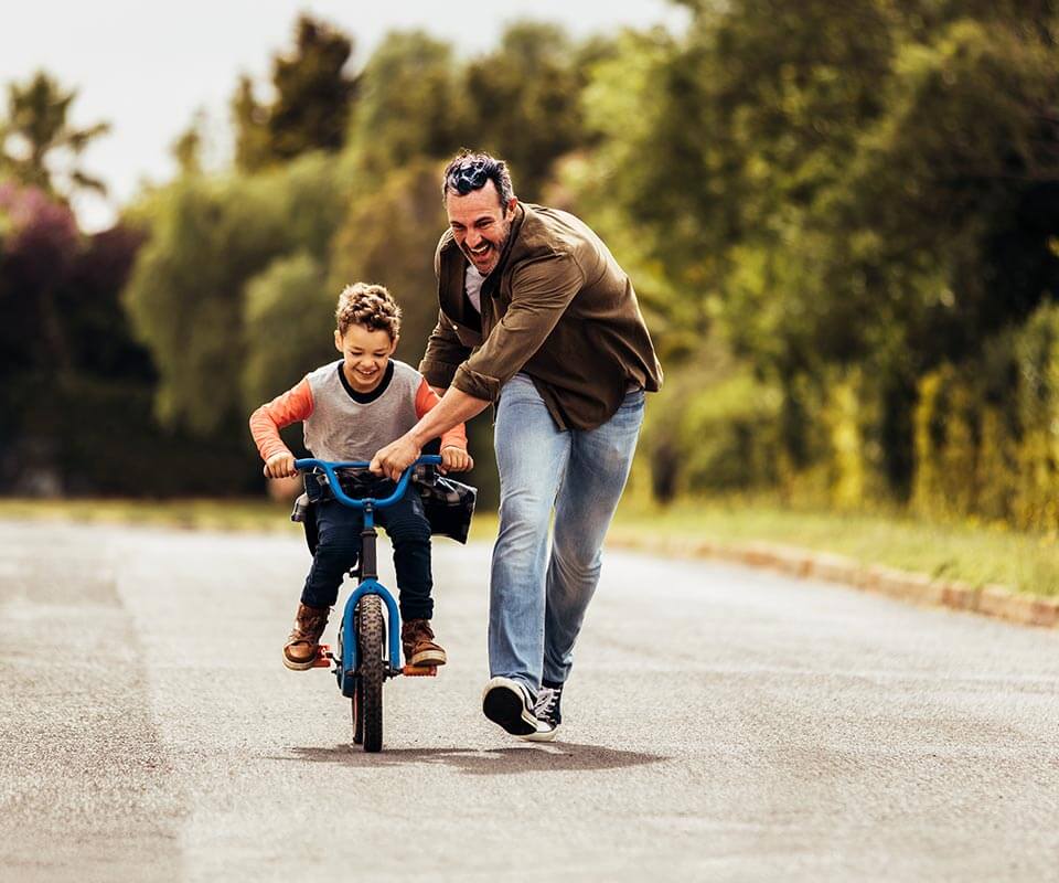 father and son biking