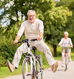 Man and woman riding bikes