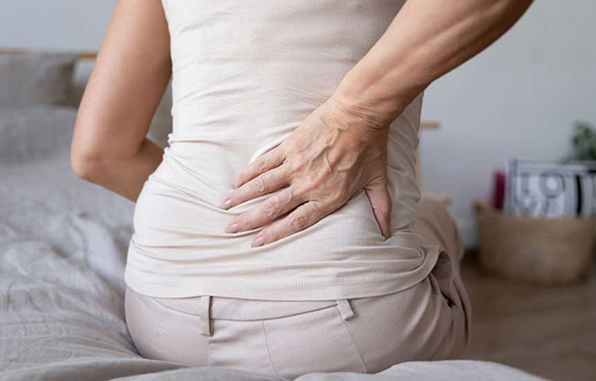 Woman clutching her back