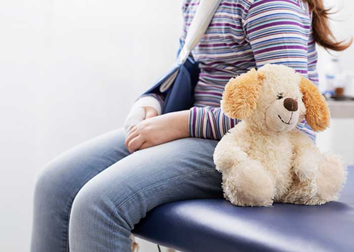 Child wearing a sling