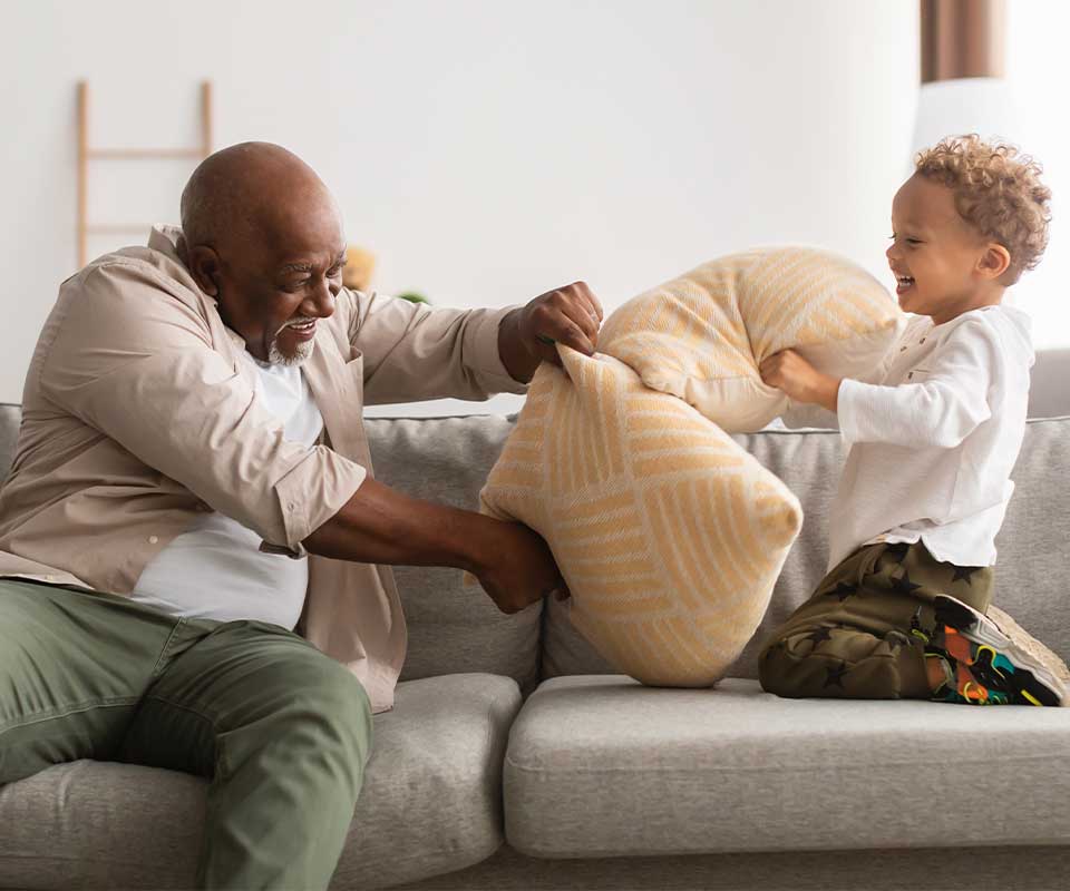 grandfather playing with grandchild