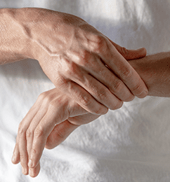 Woman clutching wrist